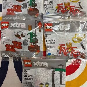 FIVE LEGO xtra polybags. ALL UNOPENED. 2x bicycles, 2 x Chinatown 1x Streetlamps